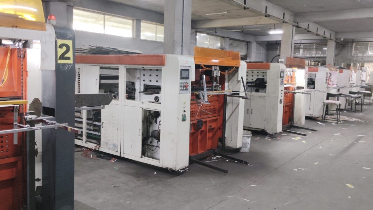 Paper cup blank die-cutting machines on the factory floor